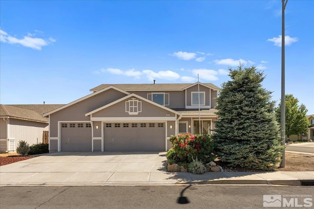 view of front of house with a garage and concrete driveway