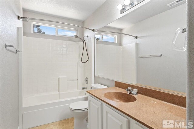 full bathroom featuring shower / bathing tub combination, vanity, toilet, and tile patterned flooring