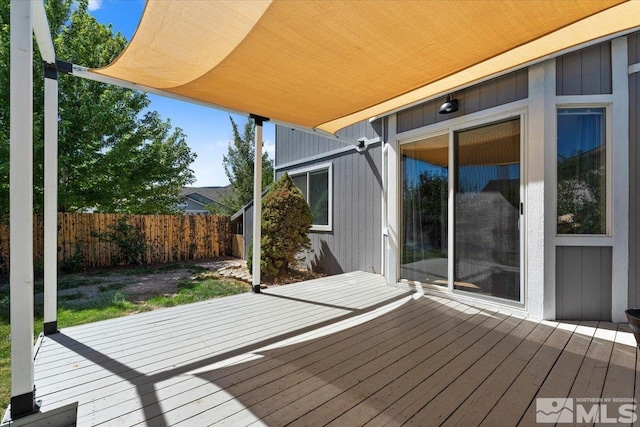 wooden deck featuring fence