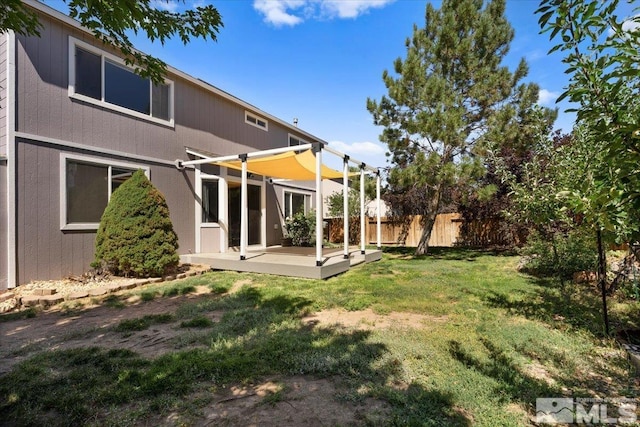 view of yard with a wooden deck and a pergola