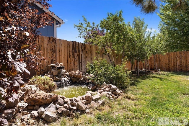 view of yard featuring fence