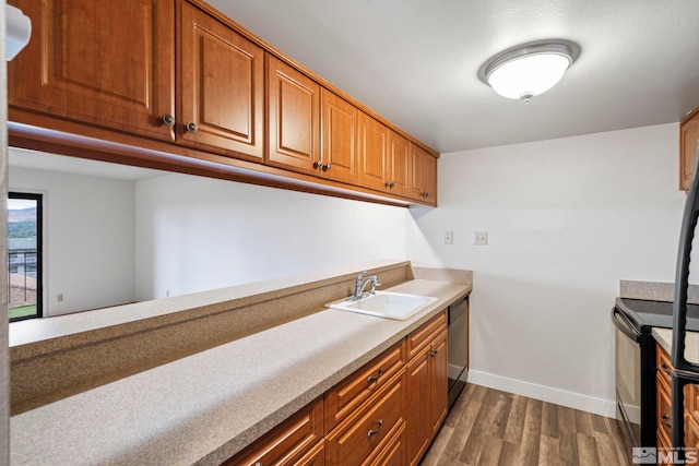 kitchen featuring black range with electric stovetop, dark wood-type flooring, sink, and stainless steel dishwasher