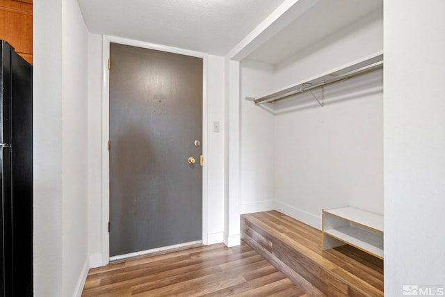 mudroom with hardwood / wood-style floors