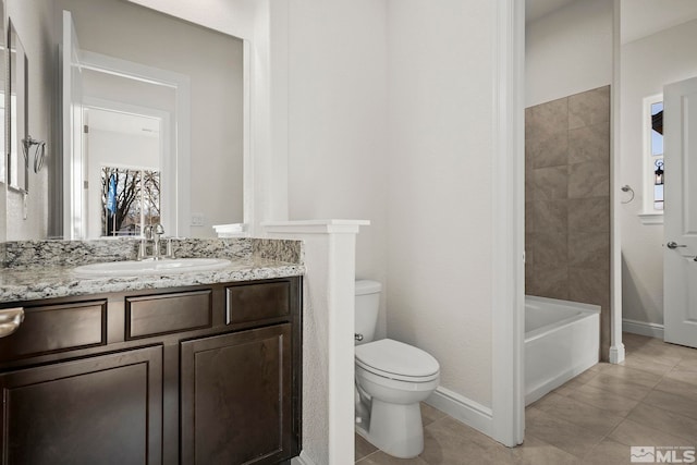 bathroom featuring tile patterned flooring, vanity, and toilet