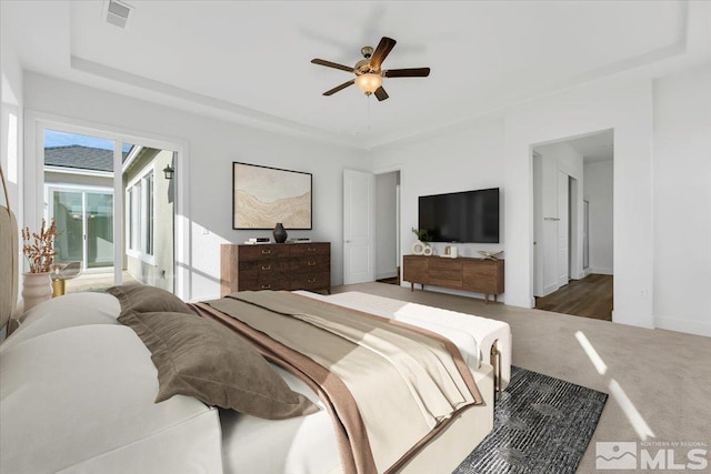 bedroom featuring carpet, access to exterior, and ceiling fan