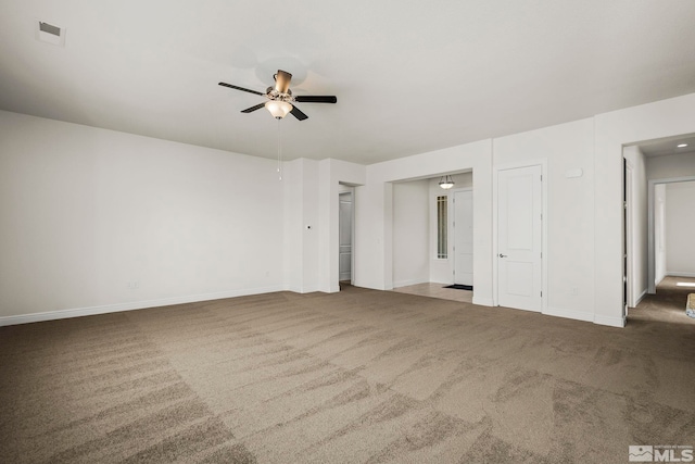 unfurnished bedroom featuring ceiling fan and dark colored carpet