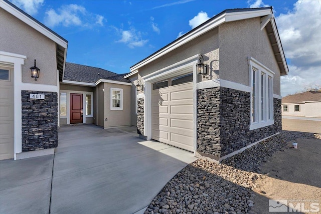 view of side of home with a garage