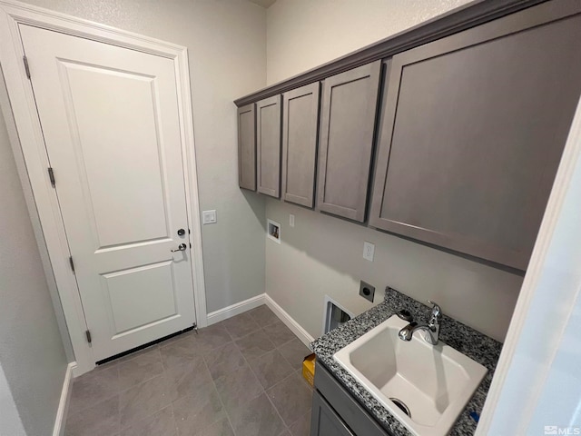 laundry area featuring sink, cabinets, electric dryer hookup, hookup for a washing machine, and light tile patterned floors