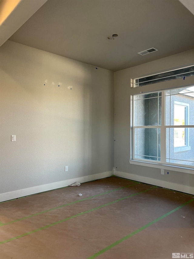 spare room with visible vents and baseboards