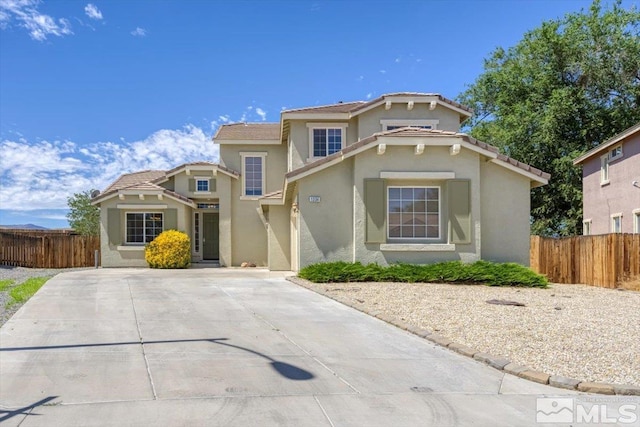 view of front of property featuring fence and stucco siding