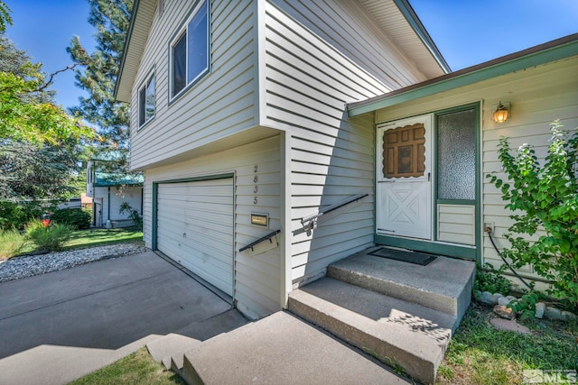 doorway to property featuring a garage