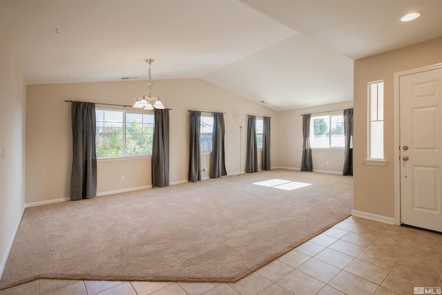 interior space featuring a notable chandelier and lofted ceiling