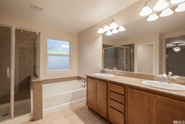 bathroom with double sink vanity, ceiling fan, tile patterned flooring, and separate shower and tub