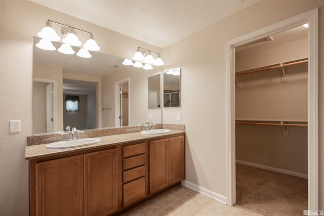 bathroom with dual vanity and tile patterned floors