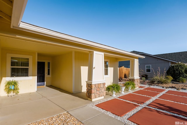 property entrance with a patio