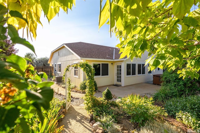 rear view of property with a patio and cooling unit