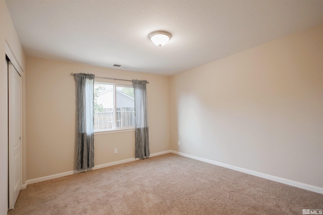 empty room featuring carpet flooring