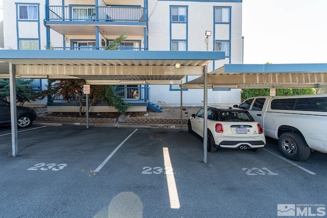 view of vehicle parking with a carport