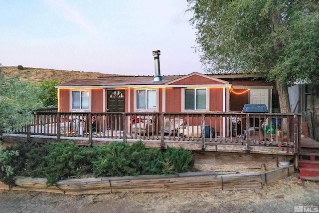 view of front of property with a deck