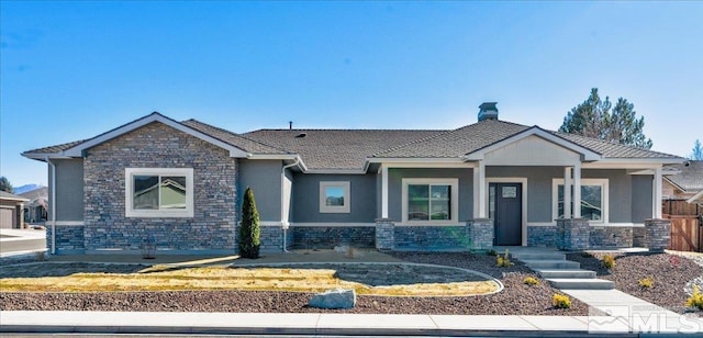 view of front of house with stone siding and stucco siding