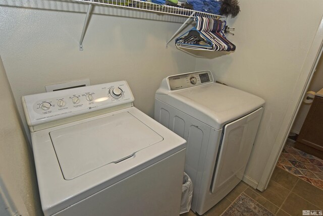 laundry room with laundry area and washing machine and clothes dryer