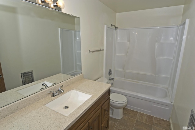 bathroom featuring visible vents, vanity, toilet, and tub / shower combination