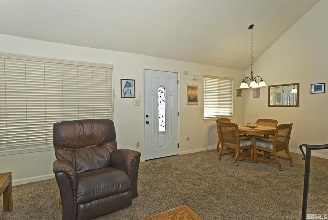 dining area with vaulted ceiling, carpet floors, a chandelier, and baseboards