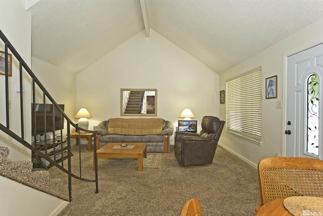 living area with carpet floors, vaulted ceiling with beams, stairway, a textured ceiling, and baseboards