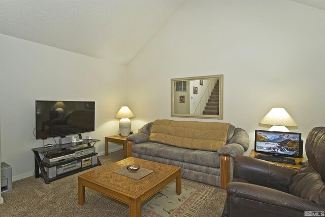 living area with lofted ceiling, stairs, baseboards, and carpet flooring