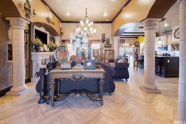 living room featuring light parquet flooring, decorative columns, and crown molding