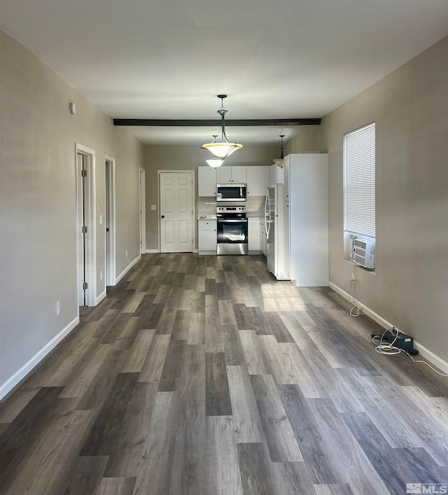 unfurnished living room with cooling unit and dark wood-type flooring