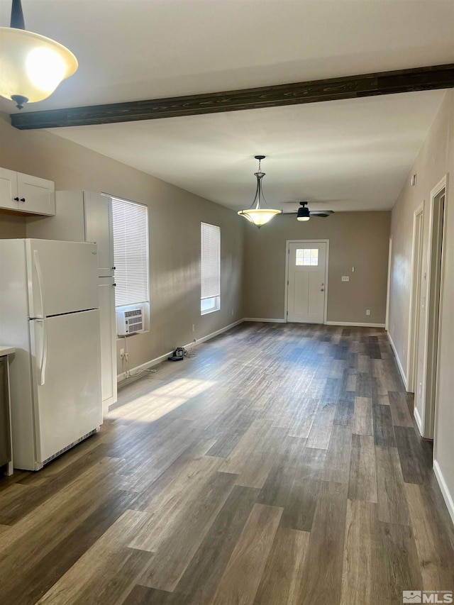 unfurnished living room with cooling unit, ceiling fan, dark hardwood / wood-style flooring, and beamed ceiling