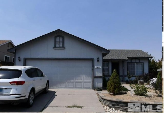 ranch-style house featuring a garage