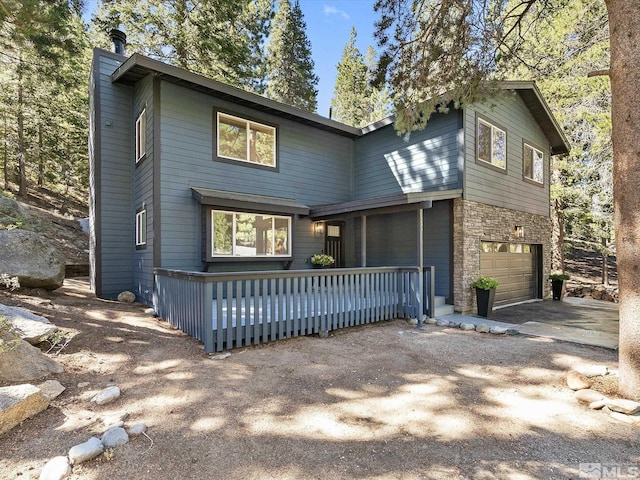 front facade with a garage