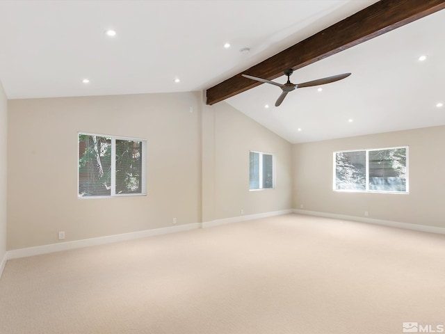 carpeted spare room featuring ceiling fan and lofted ceiling with beams