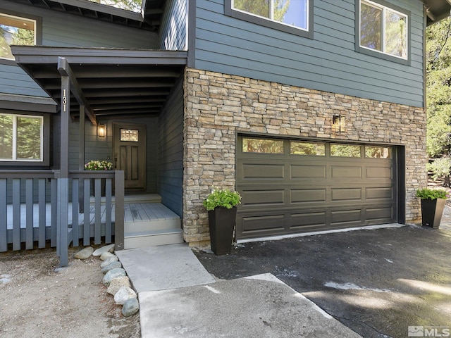 view of exterior entry featuring a garage