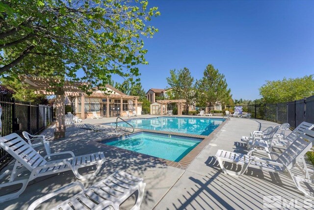 view of pool featuring a pergola and a patio