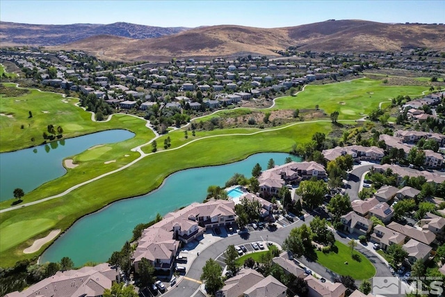 birds eye view of property featuring view of golf course, a residential view, and a water and mountain view