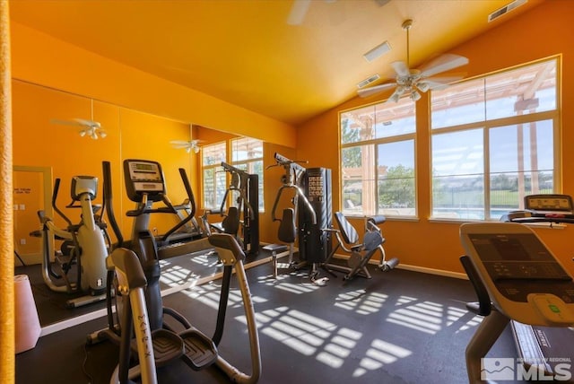 exercise room with visible vents, plenty of natural light, a ceiling fan, and lofted ceiling