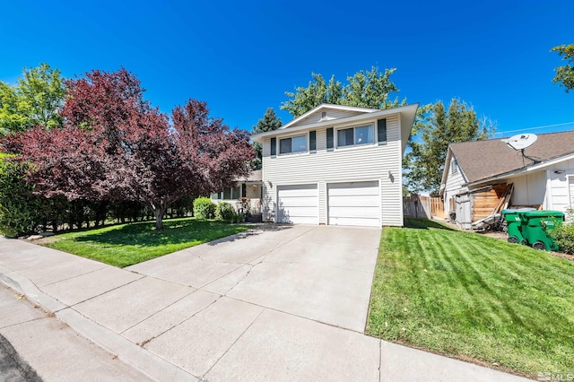 view of front of home featuring a garage and a front yard