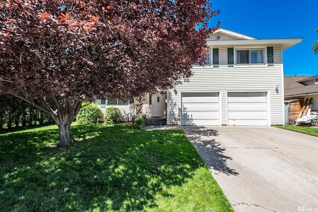 view of front of property featuring a garage and a front yard