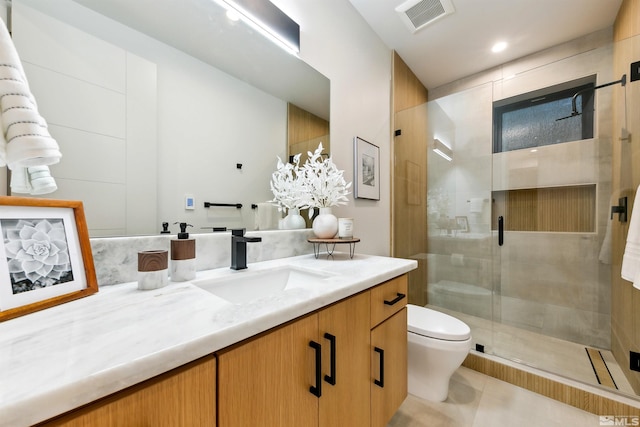 bathroom featuring visible vents, toilet, tile patterned flooring, vanity, and a shower stall