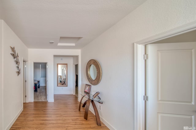 hall with light wood-type flooring