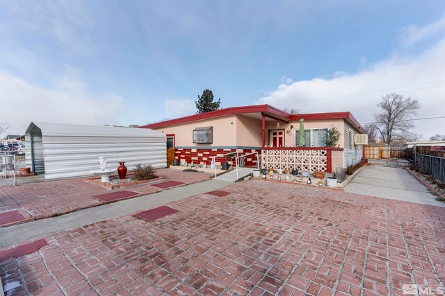 view of front of property with a patio