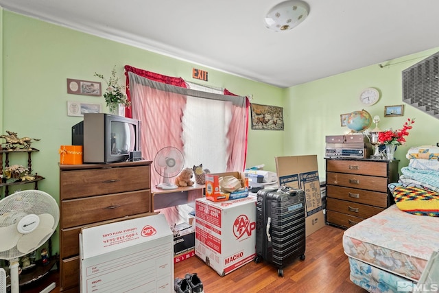 bedroom featuring wood finished floors