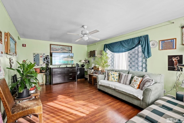 living room with a ceiling fan and wood finished floors