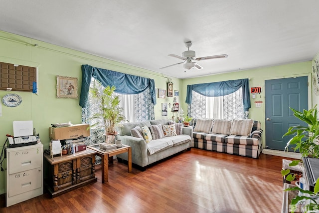 interior space with a ceiling fan and wood finished floors