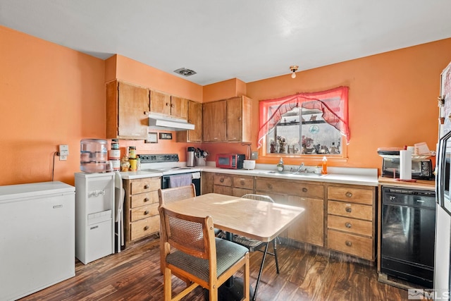 kitchen featuring dishwasher, refrigerator, light countertops, under cabinet range hood, and a sink