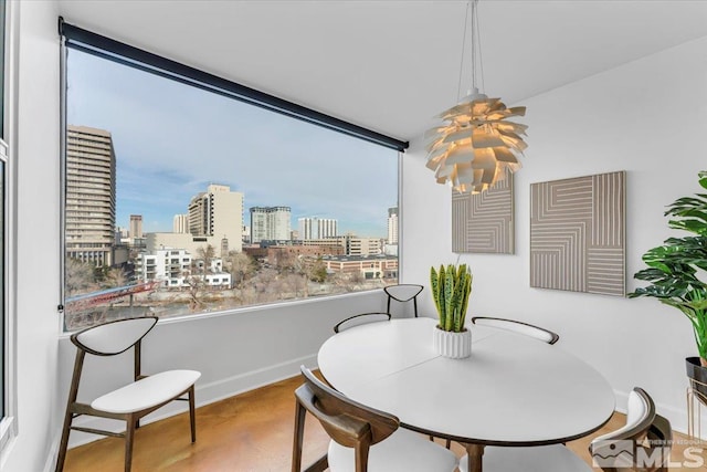 dining space featuring a notable chandelier