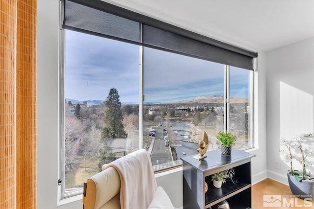 living area featuring a wall of windows